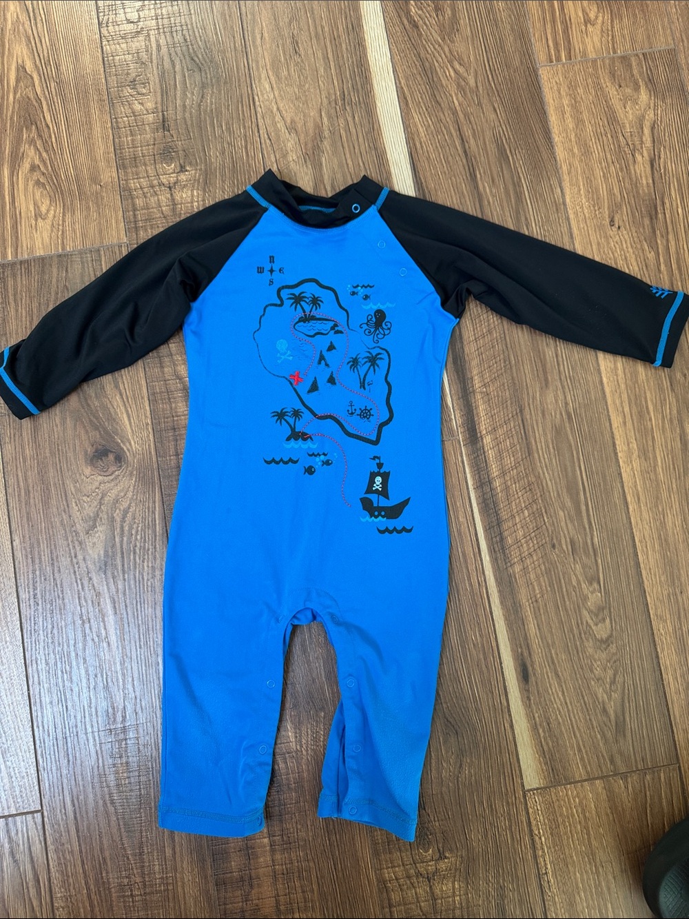 Coolibar Blue and Black Kids One-Piece Swim Suit with Pirate Map